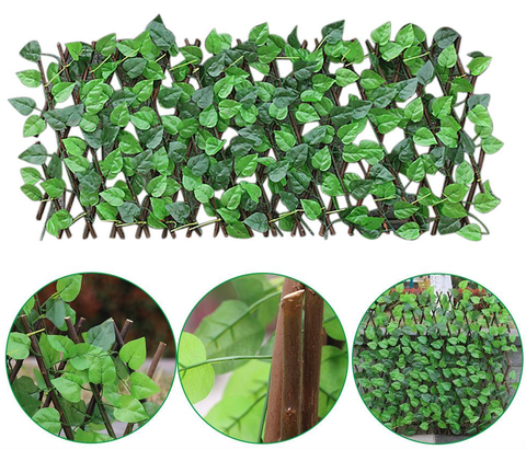 Détail du bois de saule et des plantes artificielles sur la clôture